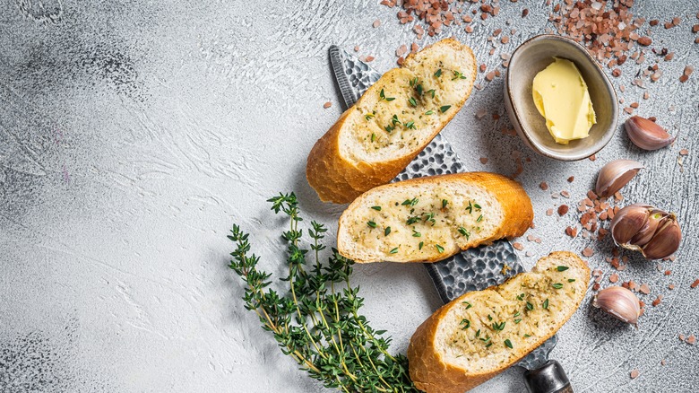 Garlic bread with butter and herbs 