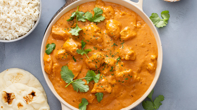 chicken tikka masala with rice and herbs