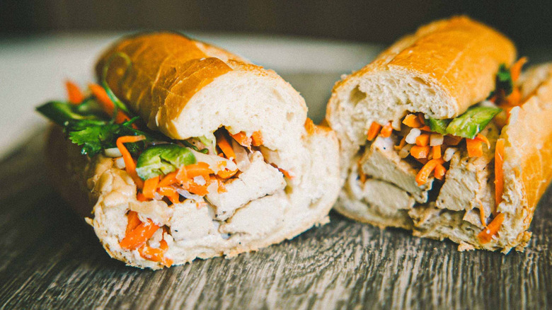 Banh mi on baguette on a wooden table