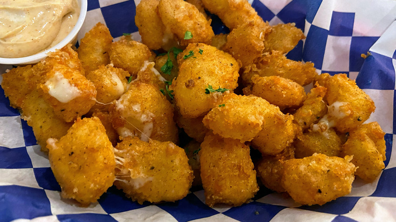 fried cheese curds served on paper