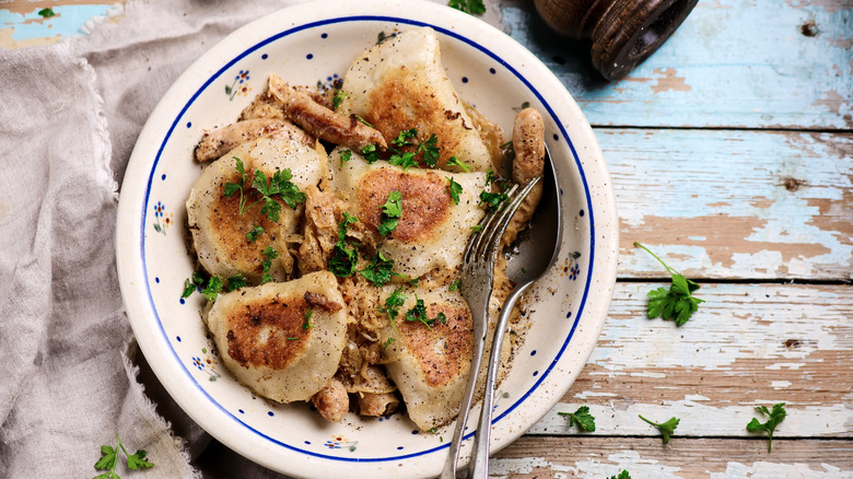 pierogies and sauerkraut served in bowl
