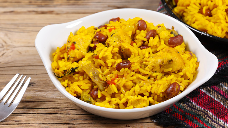 chicken and yellow rice in white dish