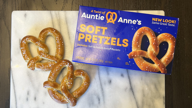 Auntie Anne's frozen pretzels on marble board next to box