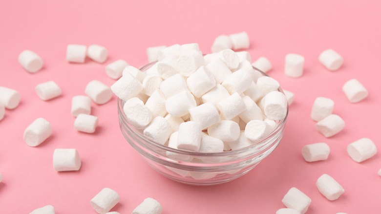 bowl of marshmallows on pink background