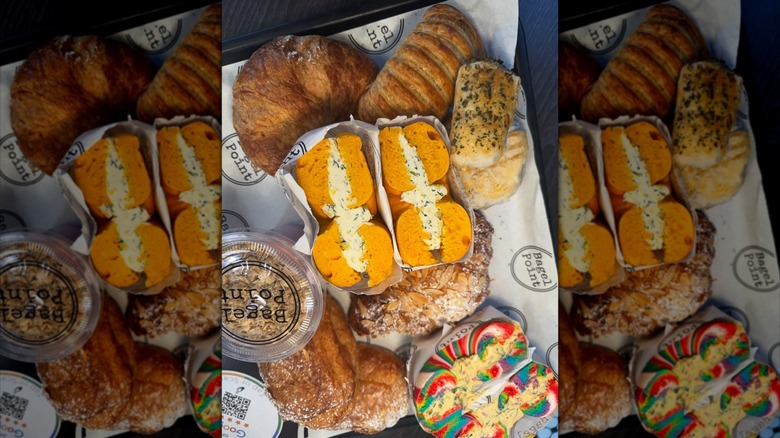 a platter of bagels and baked goods from Bagel Point