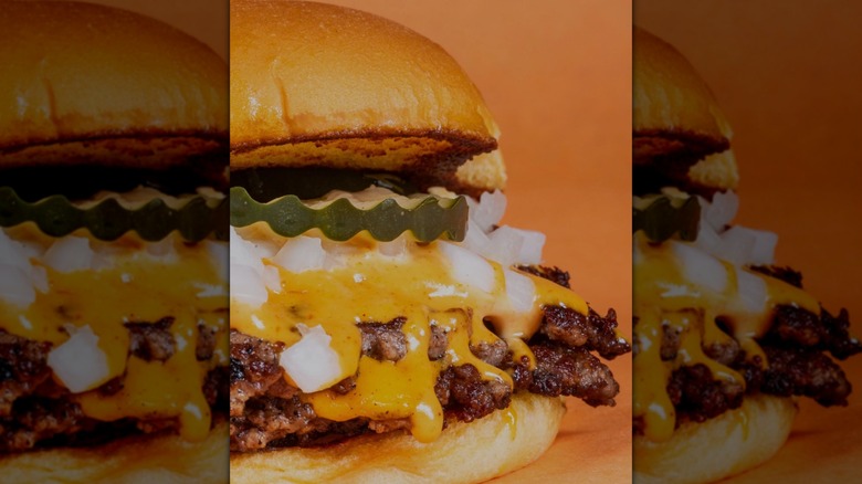 Double cheeseburger with onions and pickles