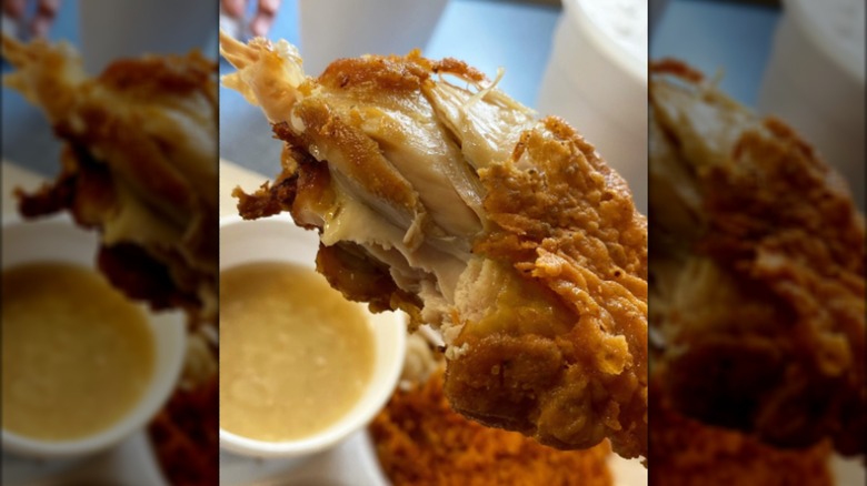 Piece of fried chicken with a bite taken out