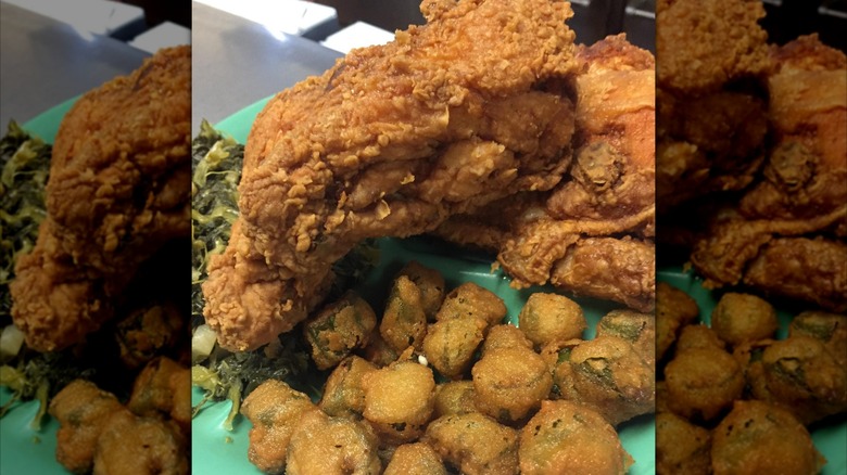 Deep fried chicken and collard greens on plate