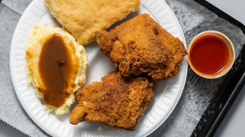 Fried chicken with mashed potatoes and gravy and sauce