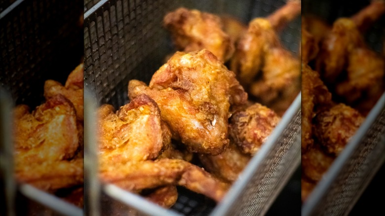 Fried chicken in a fryer basket