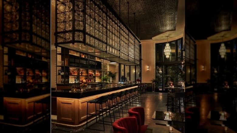 Dark bar with chandelier
