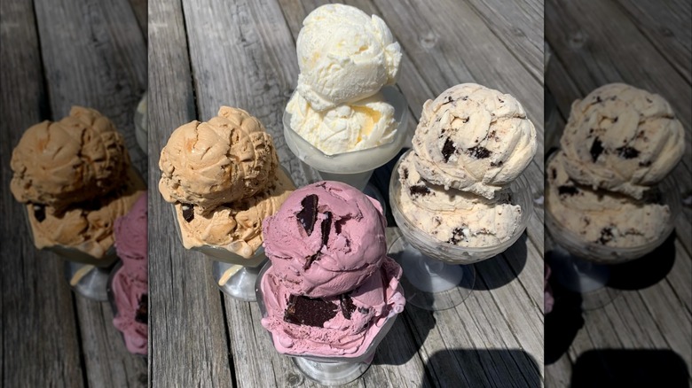 Scoops of ice cream in glasses on a table