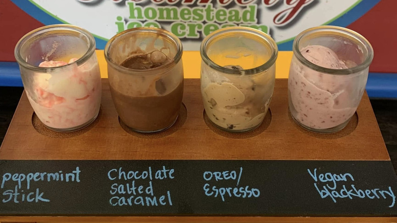 Four flavors of ice cream in rustic glass jars