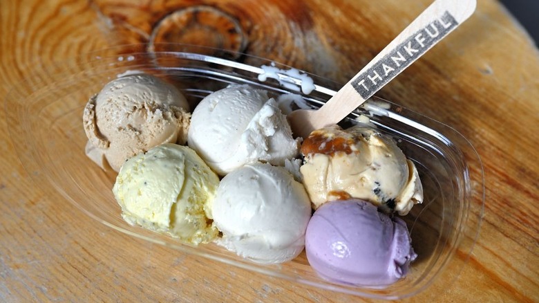 Flight with six different flavors of ice cream and spoon reading "Thankful"