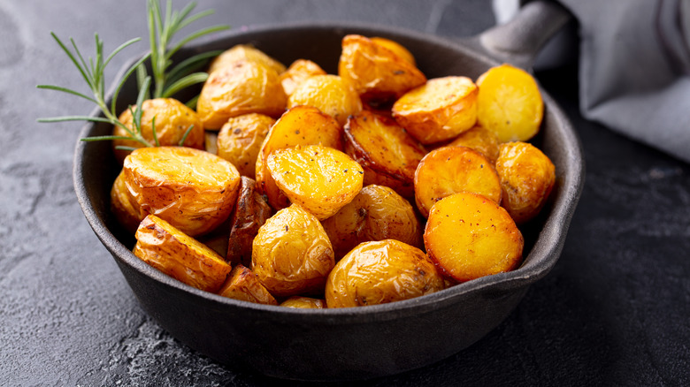 Roasted potatoes in a small skillet.