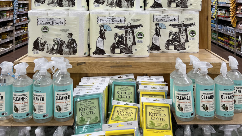 Trader Joe's kitchen essentials end cap in a store filled with paper towels, kitchen cloths, and multi-purpose cleaners