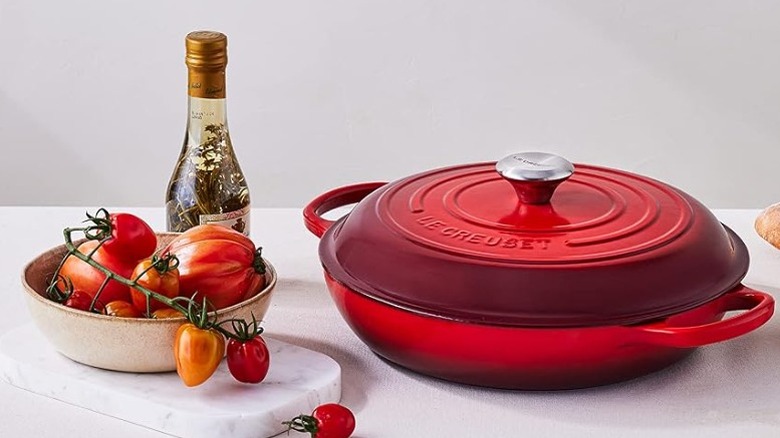 Enameled Dutch oven braiser on white background
