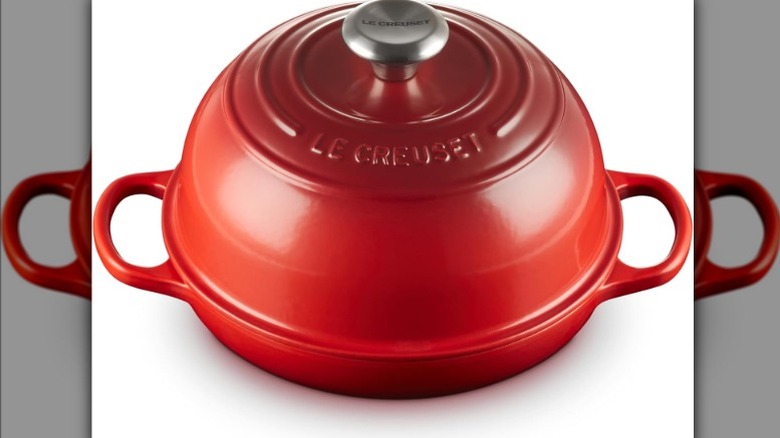 Le Creuset bread oven on white background
