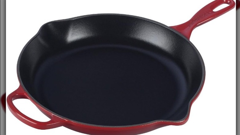 Pan with enameled cast iron interior