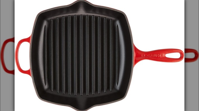 Enameled grill pan on white background