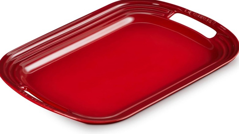 Le Creuset stoneware platter on white background
