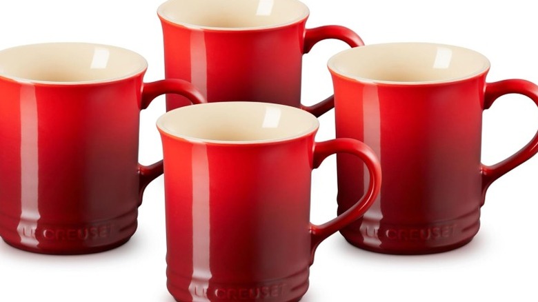 Le Creuset mugs on white background