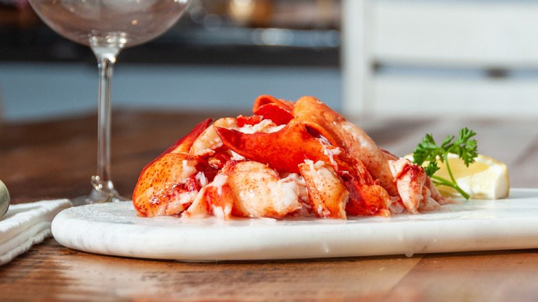 Pile of lobster knuckle and claw meat on a marble platter
