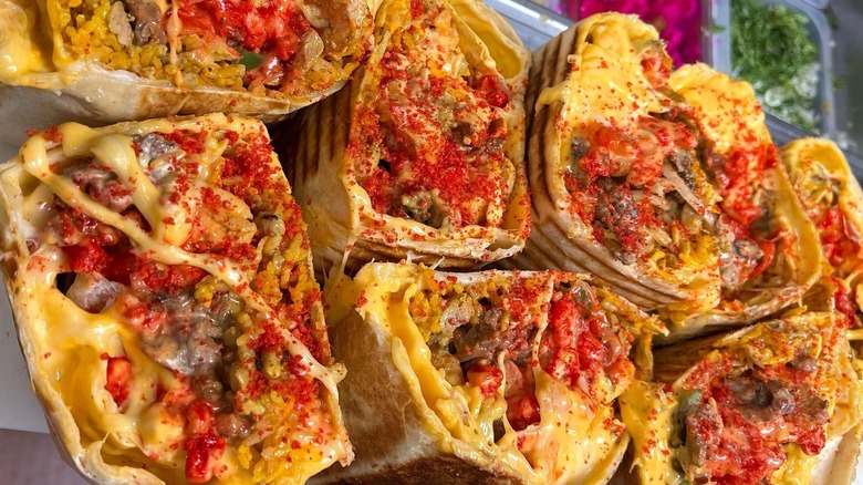 A row of Hot Cheetos-dusted burritos from Fatima's Grill