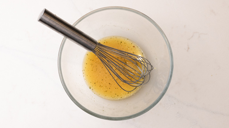 stock with whisk in bowl