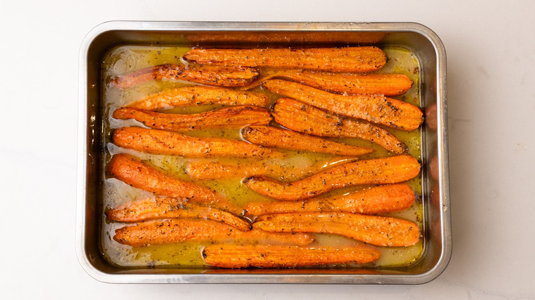 carrots in tray with stock