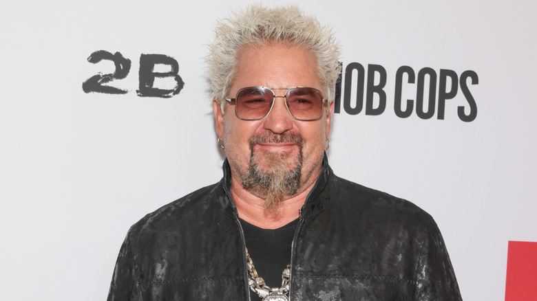 Guy Fieri in leather smiling