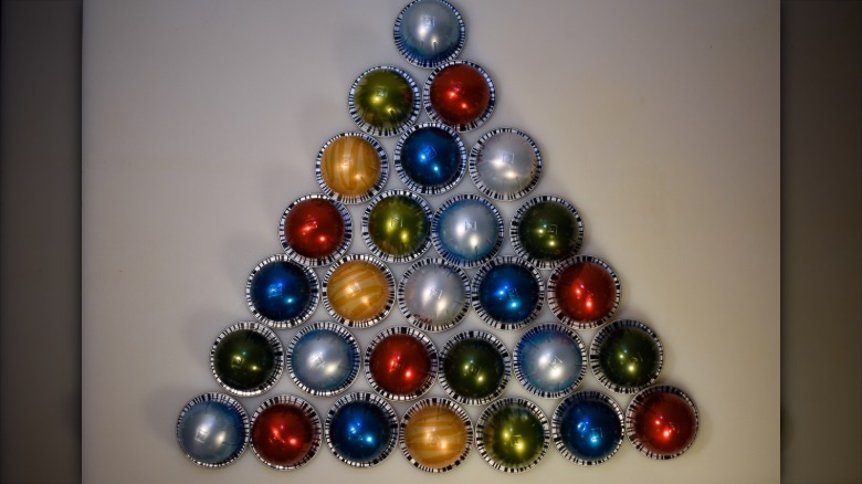 different color Nespresso pods in a triangle