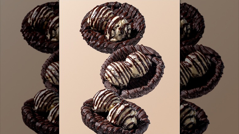 Crumbl Khloé's Cookie's & Cream Skillet Cookie on a beige background