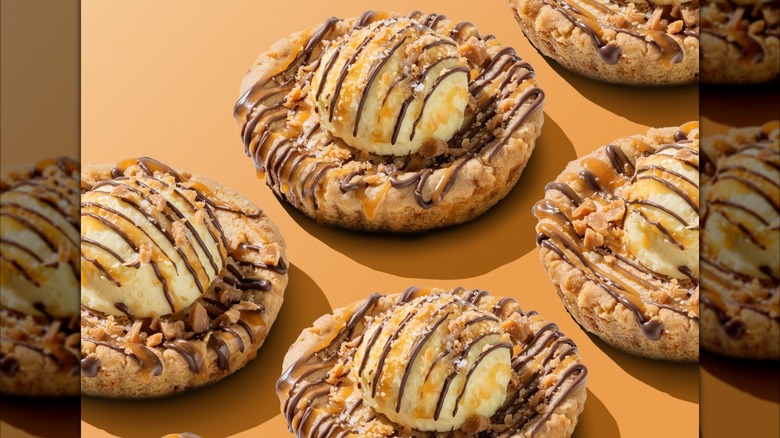 Crumbl Sea Salt Toffee Skillet Cookies on an orange background