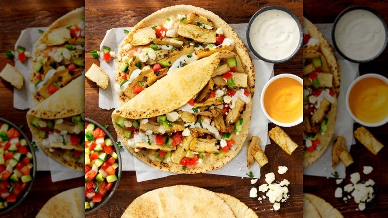 Pita bread with Sam's Club chicken shawarma, tahini sauce, and tomato and cucumber bruschetta topping