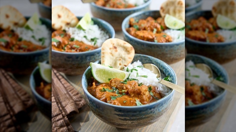 A bowl of Sam's Club chicken tikka masala with rice and mini naan bread