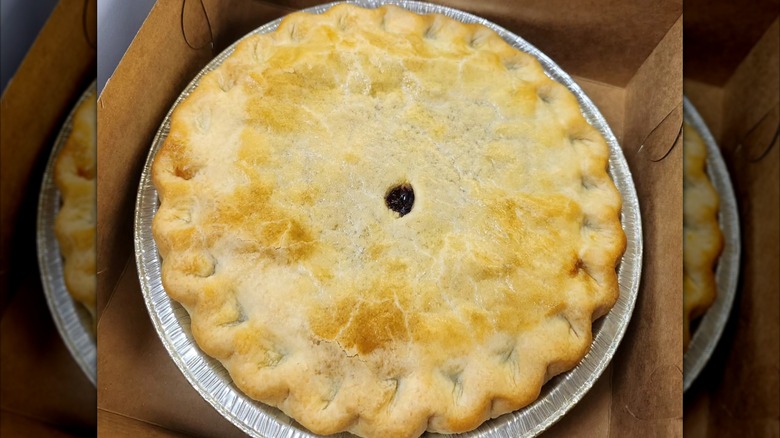 Close-up of pie with golden brown top in box