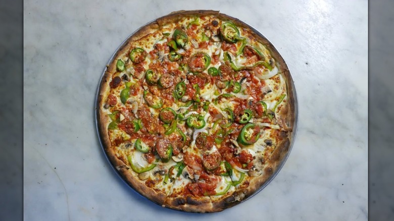 Whole pizza with jalapenos and sausage