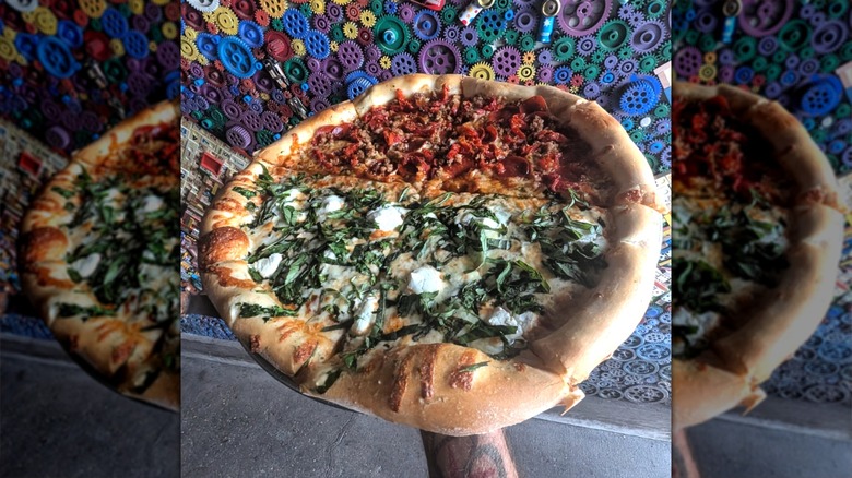 Satchel's pizza half spinach half meat