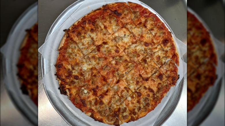 Top-down tavern-style pizza on tray