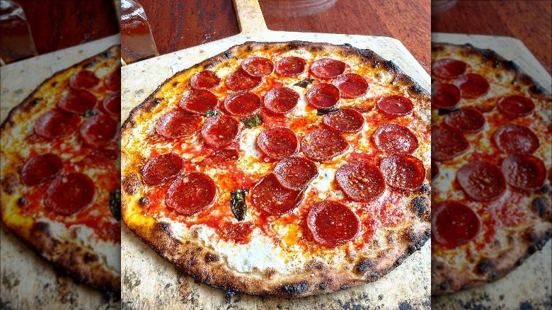 Coalfire pepperoni pizza on peel