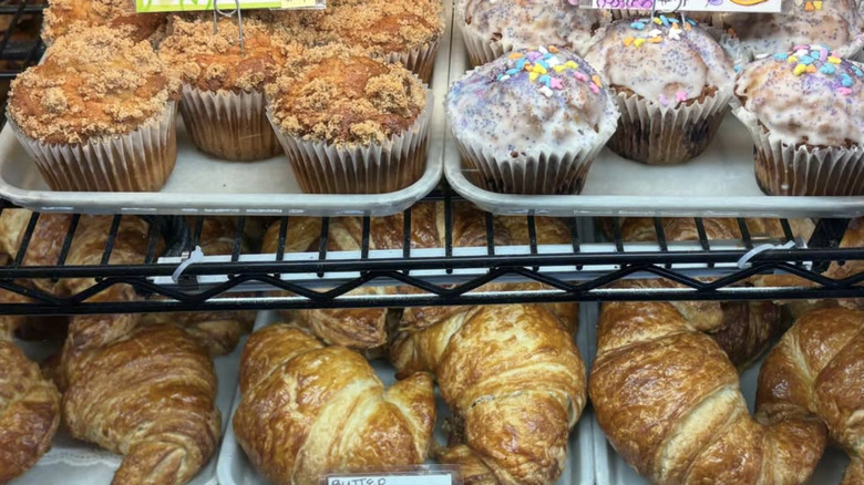 Croissants and muffins in a pastry case at Pike Place Market