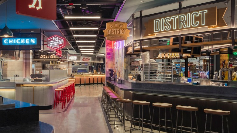 Stools and restaurant signs at the Block 16 Urban Food Hall in Las Vegas