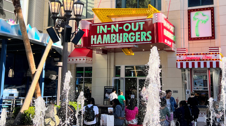 Exterior of In-N-Out at Linq with customers and a fountain