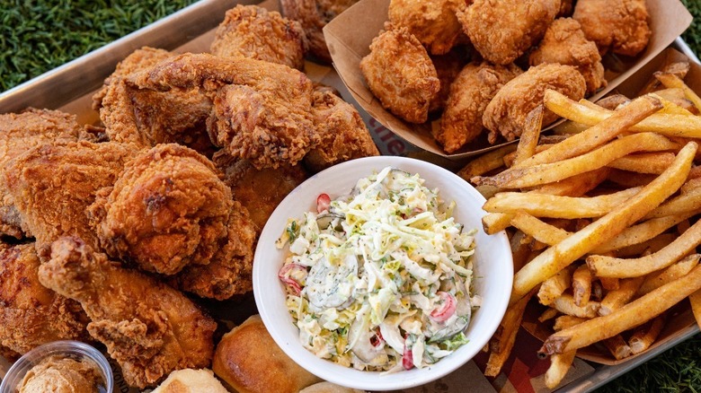Tray of fries, fried chicken, and coleslaw from Crack Shack