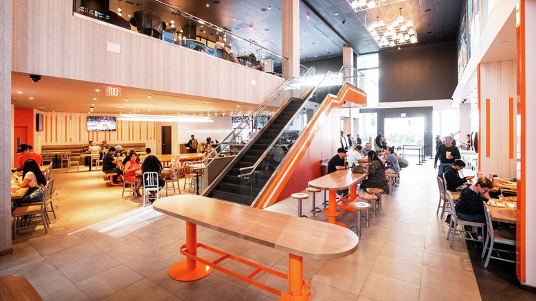 Orange interior of Whataburger with customers in Las Vegas