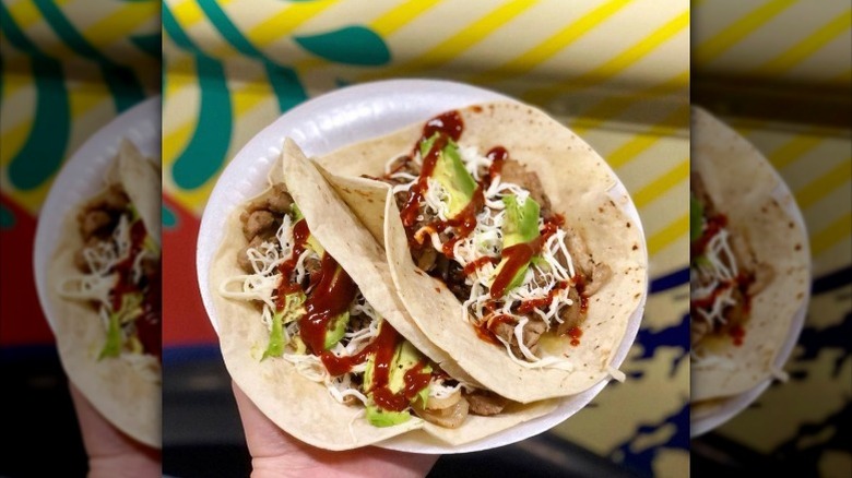 Tacos Arabes de Puebla tacos on plate hot sauce