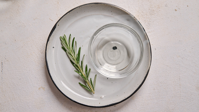 rosemary coated in simple syrup on a plate