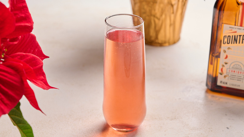 cocktail topped with prosecco on a table