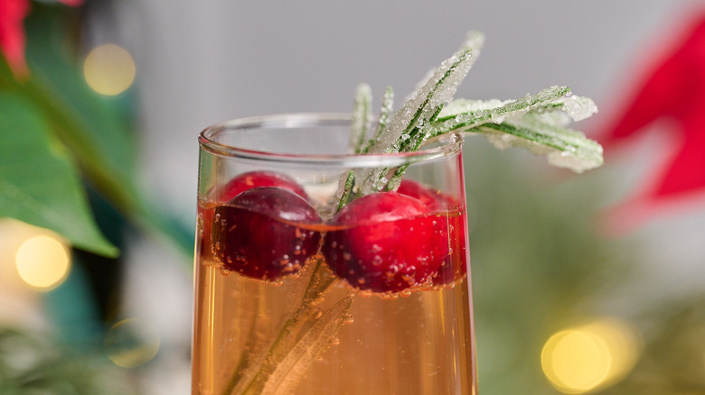 close up of sugared rosemary in a cocktail